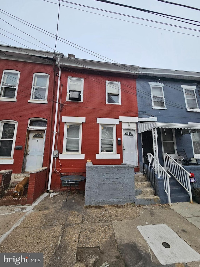 view of property with brick siding