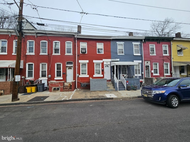 multi unit property featuring entry steps and brick siding