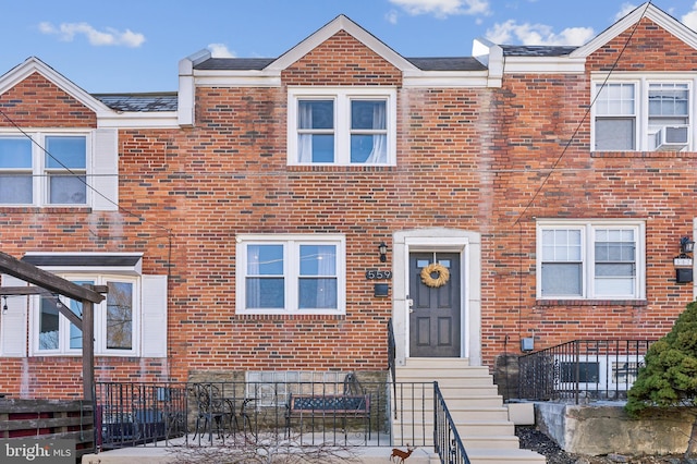 view of property featuring brick siding