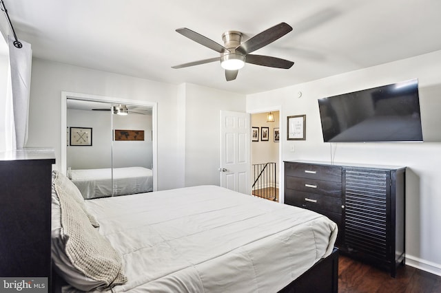 bedroom with a ceiling fan, a closet, and dark wood finished floors