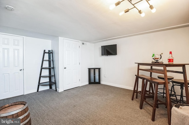 interior space featuring carpet, visible vents, and baseboards