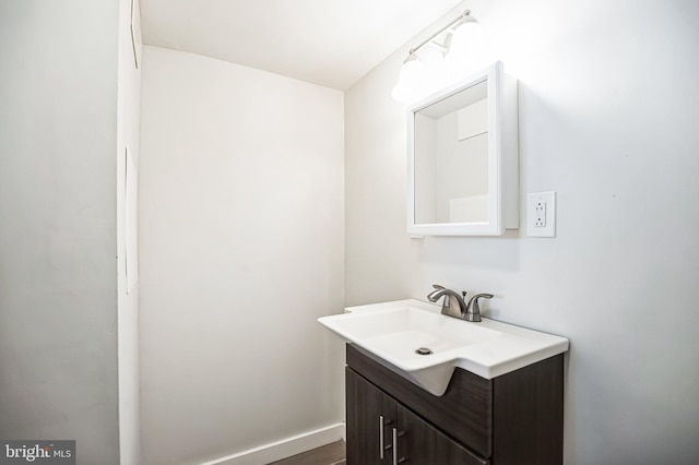 bathroom featuring vanity and baseboards