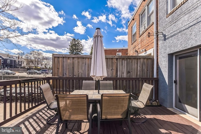 wooden deck with outdoor dining area