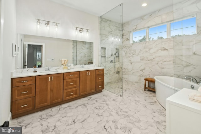 bathroom featuring double vanity, a soaking tub, a marble finish shower, and a sink