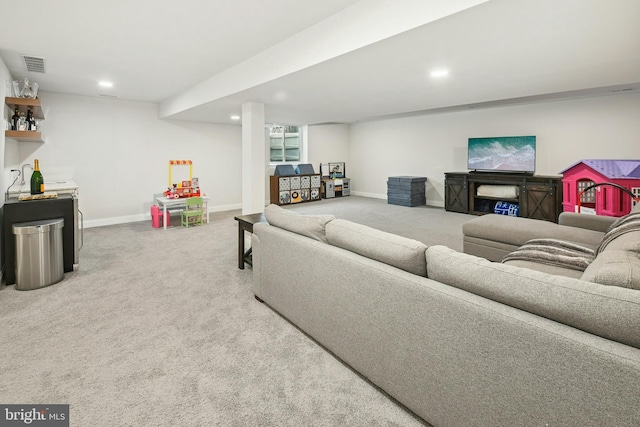 living area featuring carpet flooring, visible vents, and baseboards