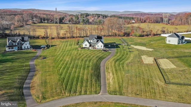 aerial view with a mountain view and a rural view