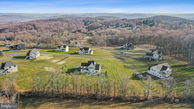 drone / aerial view with a mountain view and a rural view