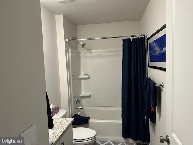 bathroom featuring vanity, toilet, and shower / bath combo with shower curtain