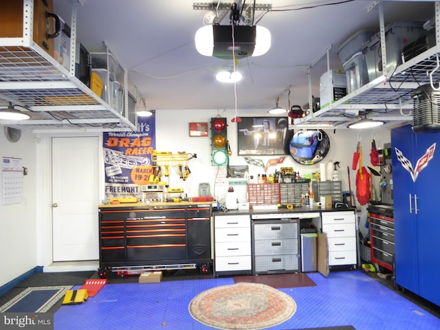 interior space with a garage door opener and a workshop area