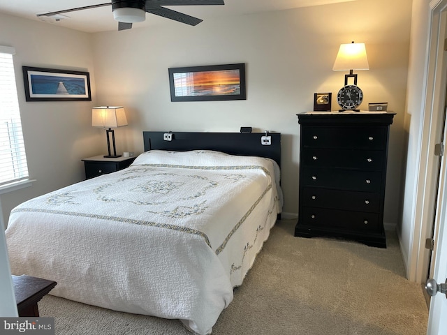 bedroom featuring ceiling fan and light colored carpet