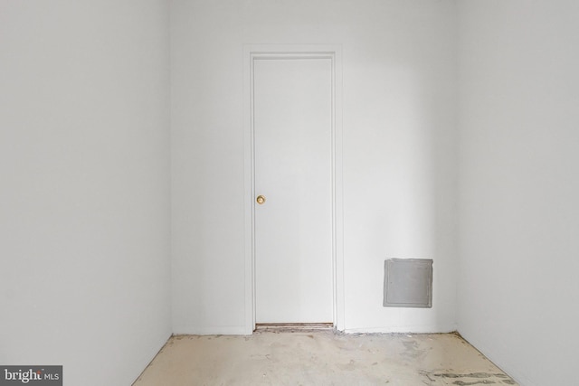 empty room with concrete flooring