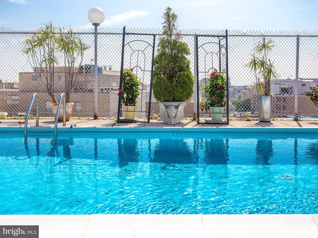 view of pool featuring fence and a fenced in pool