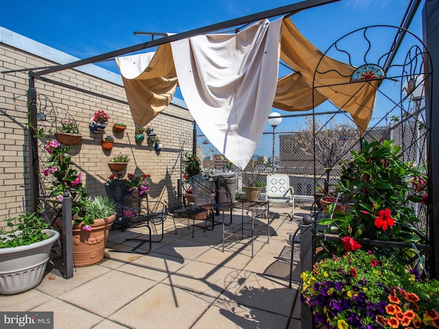 view of patio featuring fence