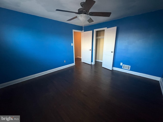 5716 Willowton Ave, Baltimore, MD 21239 - unfurnished bedroom featuring dark wood-type flooring, visible vents, baseboards, and a closet