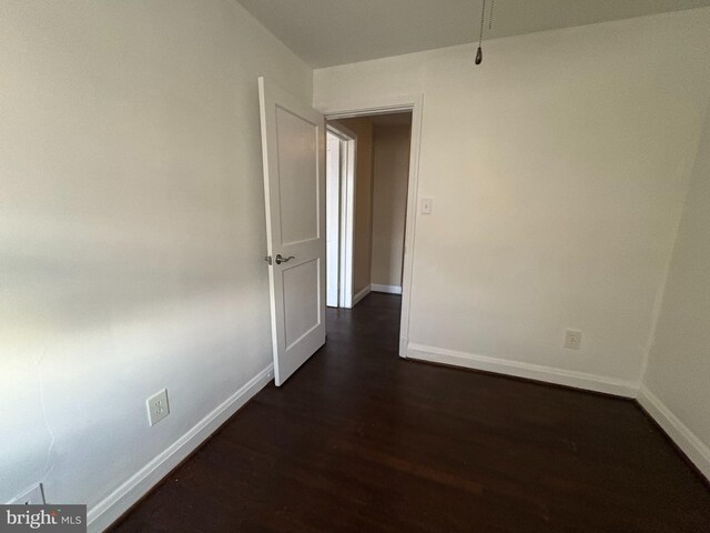 5716 Willowton Ave, Baltimore, MD 21239 - spare room with dark wood-style flooring and baseboards