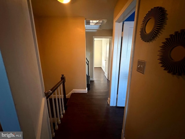 5716 Willowton Ave, Baltimore, MD 21239 - hall with baseboards, dark wood-style floors, and an upstairs landing