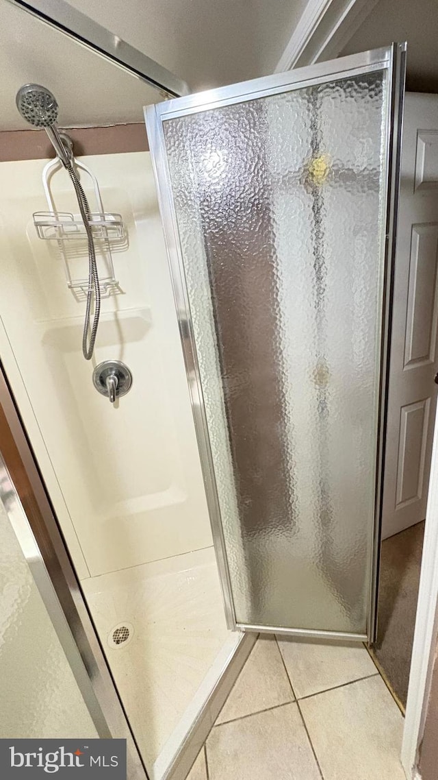 5716 Willowton Ave, Baltimore, MD 21239 - bathroom featuring a stall shower and tile patterned flooring