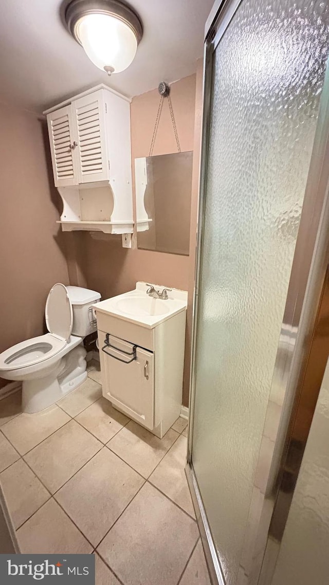 5716 Willowton Ave, Baltimore, MD 21239 - full bathroom with a shower stall, tile patterned floors, vanity, and toilet