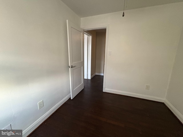 5716 Willowton Ave, Baltimore, MD 21239 - empty room featuring dark wood-style floors and baseboards