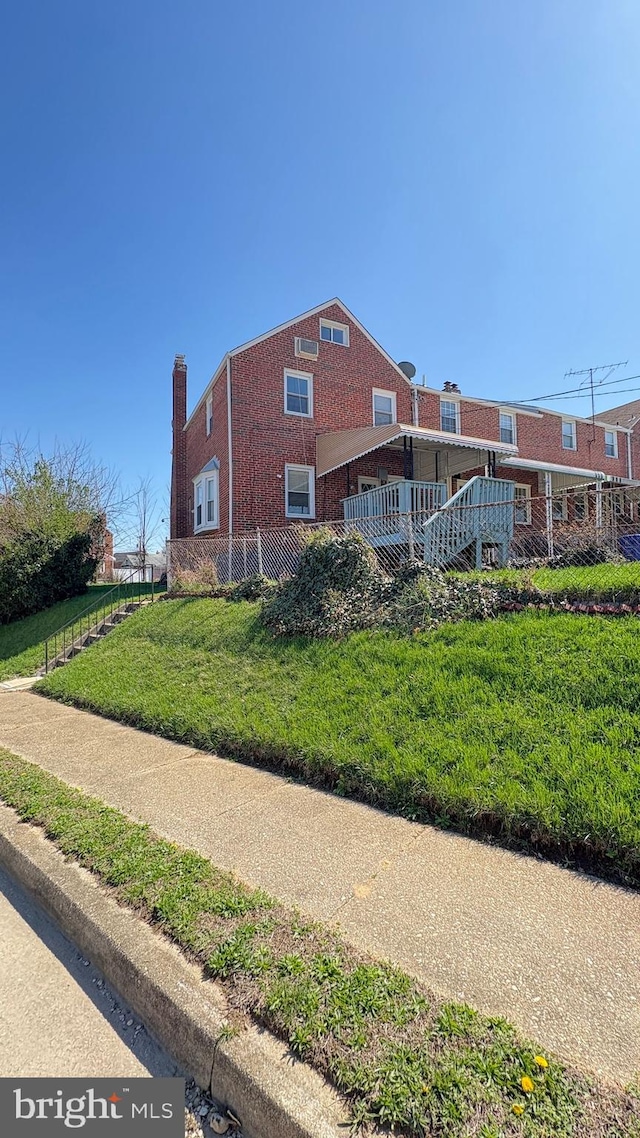 5716 Willowton Ave, Baltimore, MD 21239 - view of side of property featuring a chimney and a lawn
