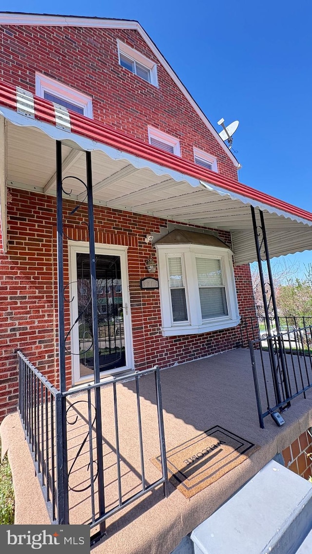 5716 Willowton Ave, Baltimore, MD 21239 - exterior space featuring brick siding and covered porch