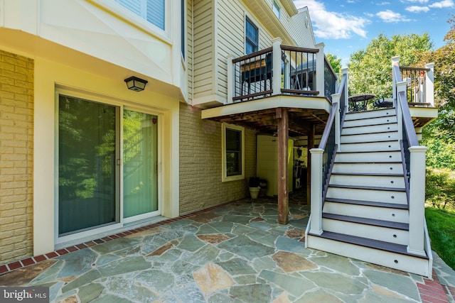 view of patio / terrace featuring stairs and a deck