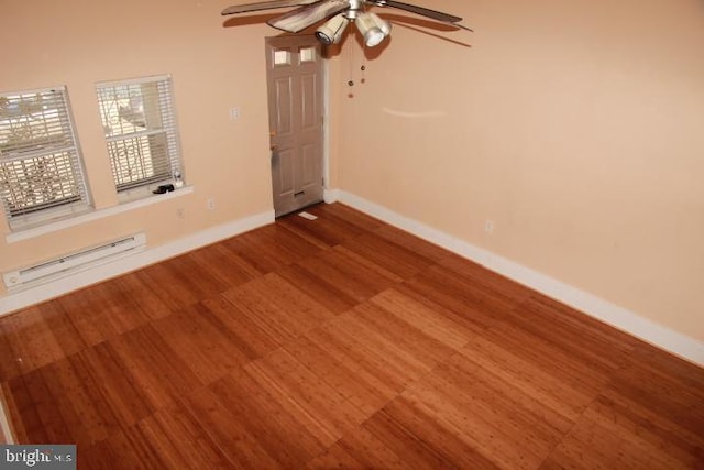 unfurnished room featuring wood finished floors, baseboards, baseboard heating, and ceiling fan