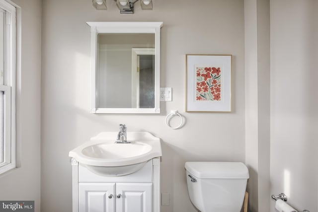 bathroom with vanity and toilet