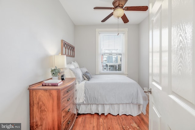 bedroom featuring ceiling fan and wood finished floors