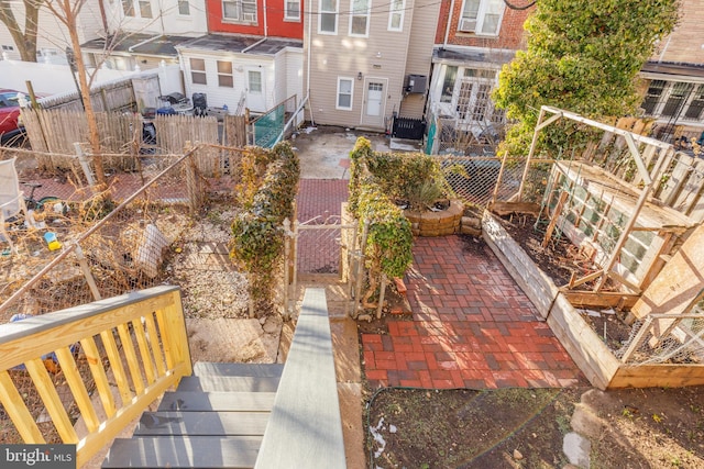 view of yard featuring a patio area and a fenced backyard