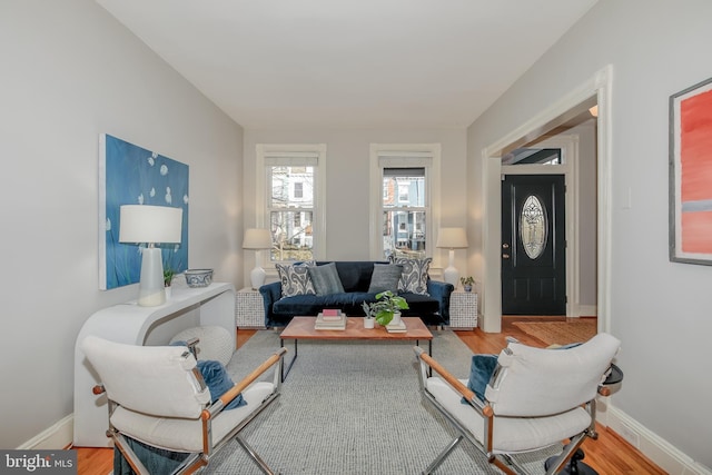 living room featuring baseboards and wood finished floors