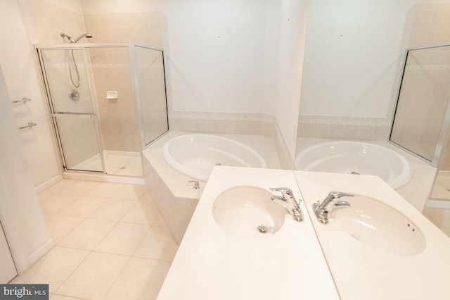 full bath featuring vanity, a stall shower, tile patterned flooring, and a bath