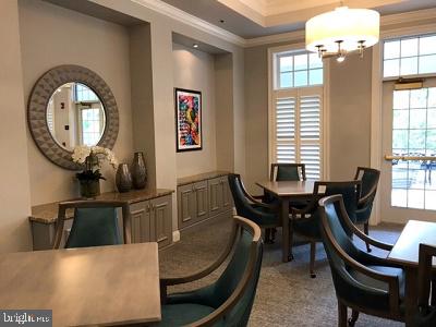 carpeted dining space featuring a notable chandelier and crown molding