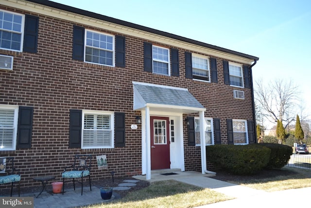 view of property featuring brick siding