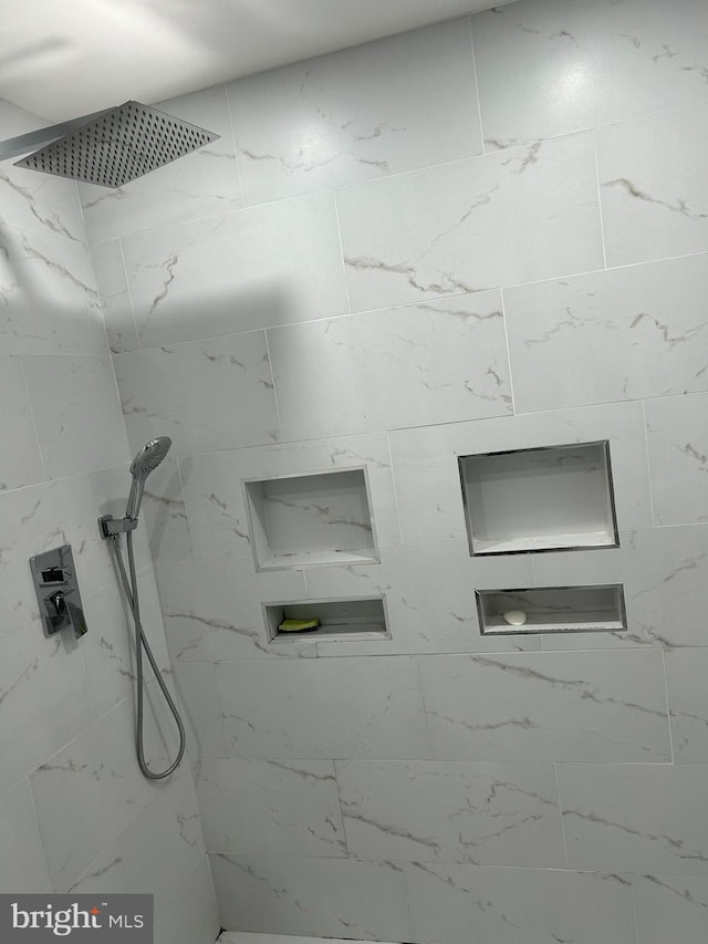 details featuring a marble finish shower