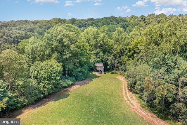 aerial view featuring a forest view