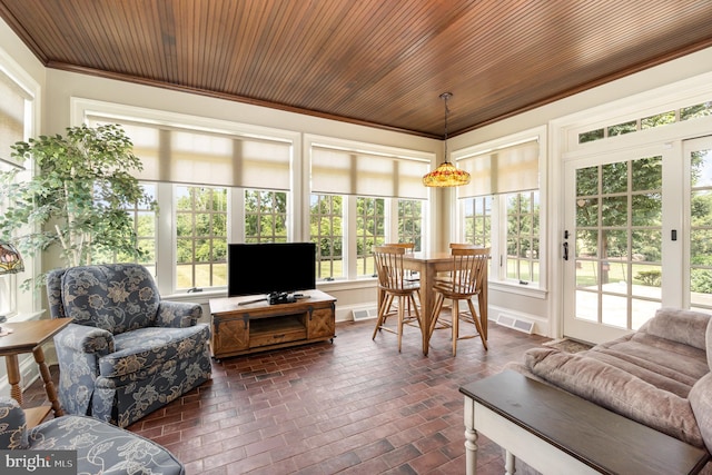 sunroom / solarium featuring wood ceiling and visible vents