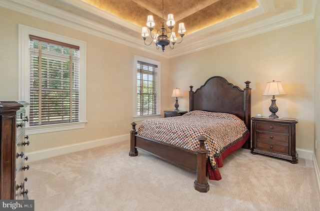 bedroom featuring light carpet, a tray ceiling, ornamental molding, and an inviting chandelier