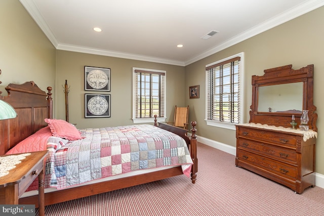 bedroom featuring ornamental molding, multiple windows, visible vents, and baseboards