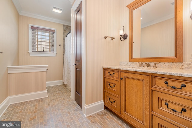 full bathroom with curtained shower, brick floor, vanity, baseboards, and ornamental molding