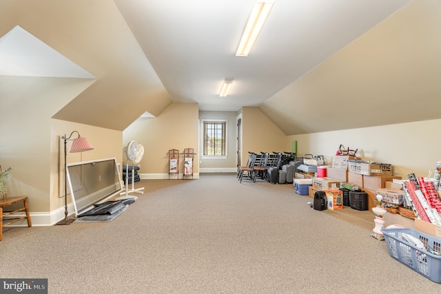 additional living space featuring lofted ceiling, carpet, and baseboards