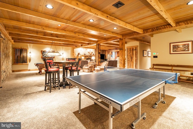 playroom featuring light colored carpet, wood ceiling, visible vents, and beamed ceiling