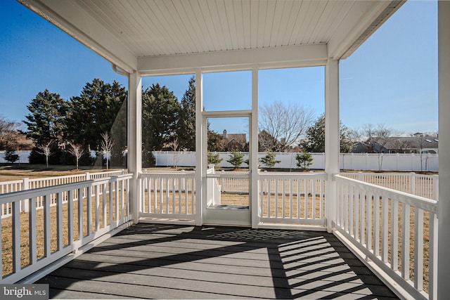 wooden terrace featuring fence