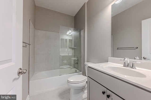 full bathroom with tile patterned flooring, bathing tub / shower combination, toilet, and vanity