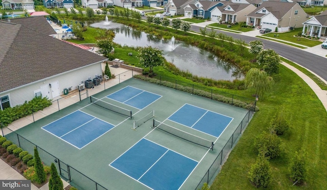 bird's eye view with a water view and a residential view