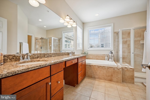 full bath featuring tile patterned flooring, a sink, a shower stall, and a bath