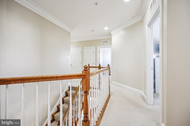 corridor featuring crown molding, visible vents, light carpet, an upstairs landing, and baseboards