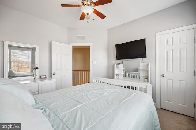 bedroom with a ceiling fan, carpet, and visible vents