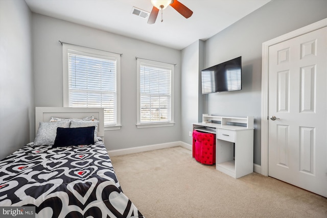 bedroom featuring baseboards, visible vents, ceiling fan, and carpet flooring