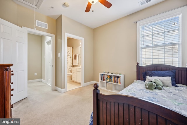 bedroom featuring baseboards, attic access, visible vents, and light colored carpet